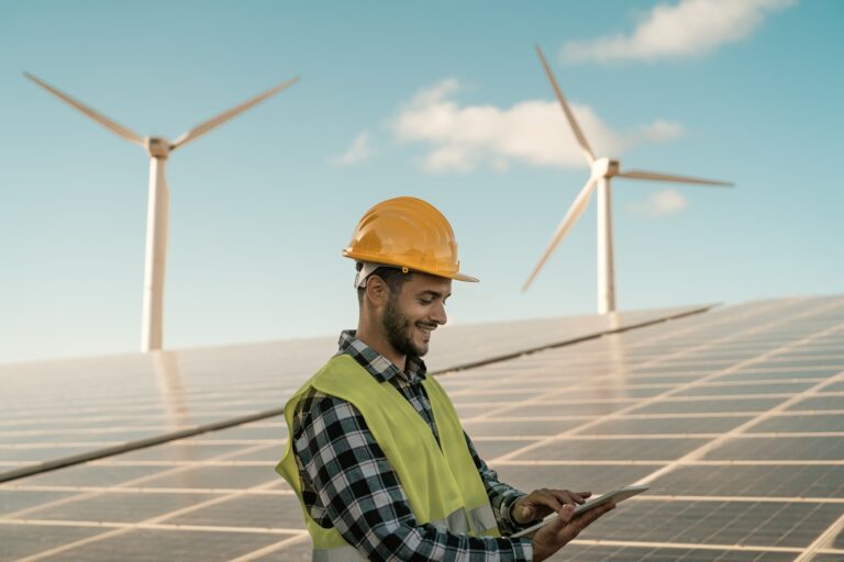 Young engineer watching on digital tablet the new green plan for alternative energy